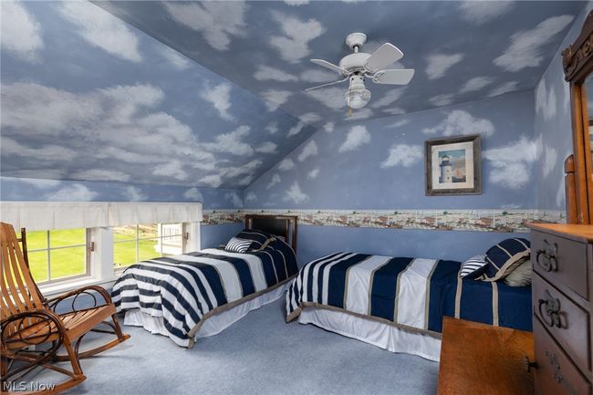 Bedroom featuring ceiling fan and vaulted ceiling | Image 35