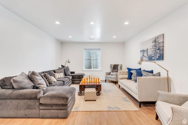 Living room with wood finished floors and recessed lighting | Image 53