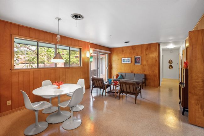 Dining space featuring wood walls | Image 21