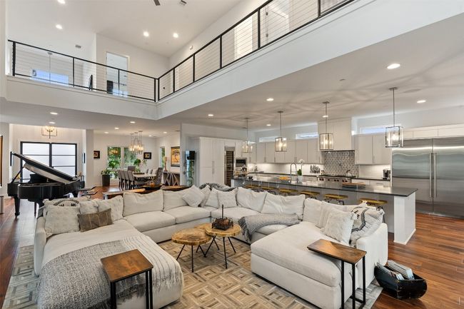 Designed for gatherings, this living room connects seamlessly to the kitchen. | Image 15