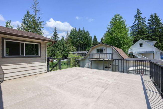 View of patio with an outbuilding and stairway | Image 26