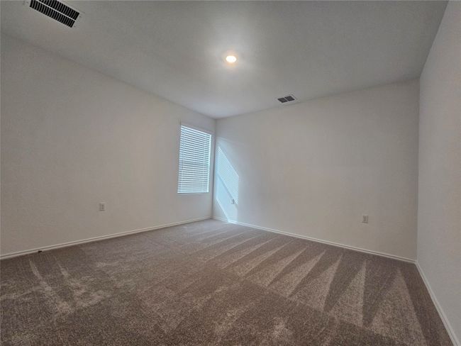 Empty room featuring baseboards, visible vents, and carpet floors | Image 21