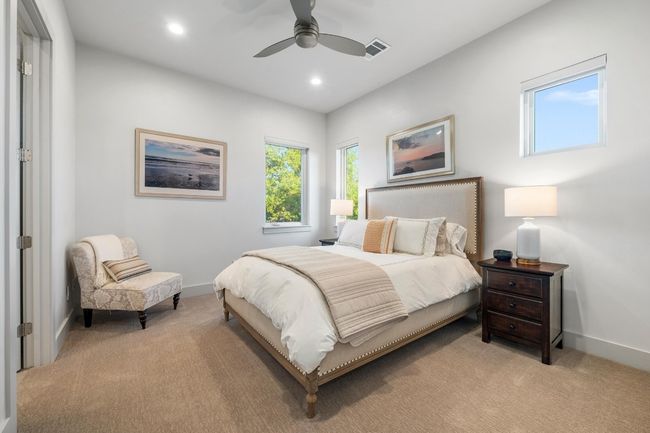 Upstairs 4th Bedroom featuring a ceiling fan, visible vents, recessed lighting, light carpet, and baseboards | Image 27
