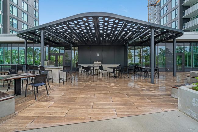 View of patio with a pergola, grilling area, and outdoor dining space | Image 18