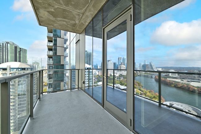 Balcony with a city view and a water view | Image 14