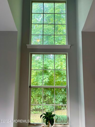 Beautiful LR window backing up to private green acres | Image 3