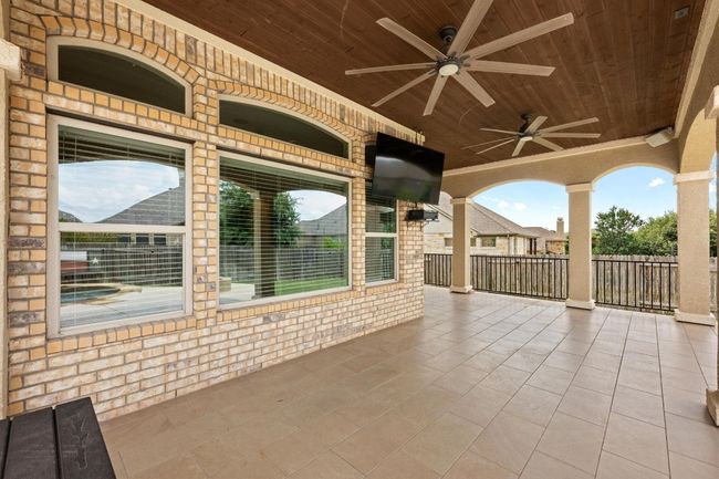 View of patio / terrace with a ceiling fan | Image 29