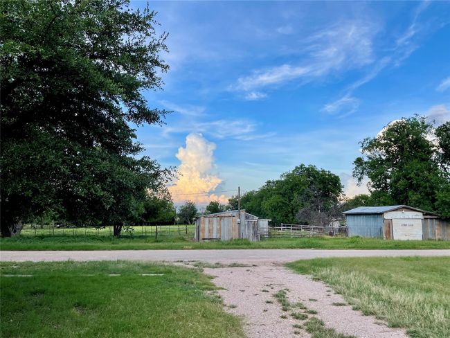 View of yard featuring an outbuilding and a rural view | Image 18