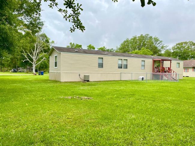 The small fenced in area off the back patio makes it easy to let your fur-baby outside or make it into a small play area for the little kiddos | Image 19