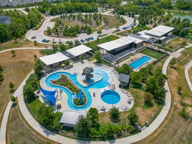 Features a single-family home with a spacious yard in Bridgeland, a master-planned community offering lakes, pools, sidewalks, and green spaces. | Image 27