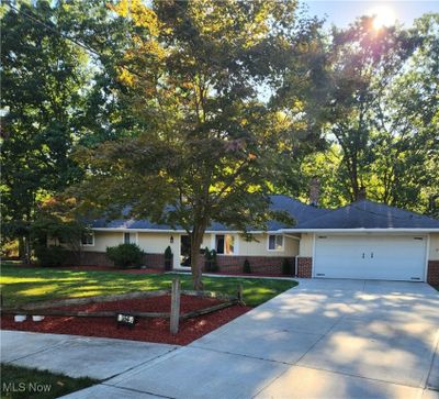 View of front facade featuring a garage and a front lawn | Image 2