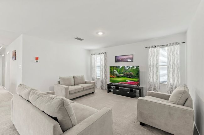 Living area with light colored carpet | Image 10