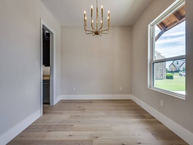 Dining Room with access to butlers pantry with custom cabinets and wine rack | Image 12