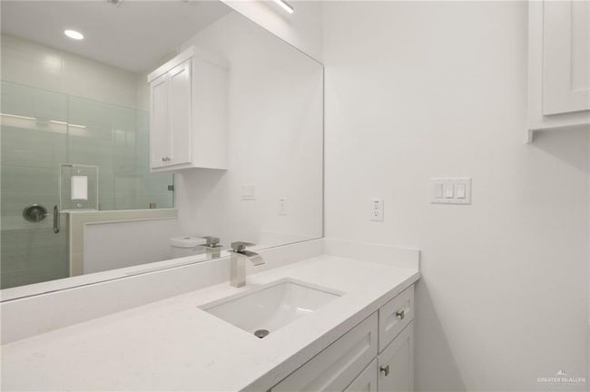 Bathroom featuring vanity, a stall shower, and recessed lighting | Image 14