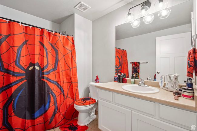 Full bath with tile patterned floors, vanity, and curtained shower | Image 32
