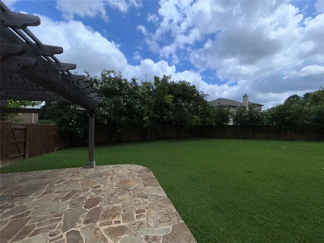 View of yard featuring a patio and a pergola | Image 27