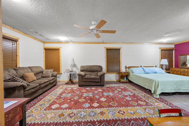 Bedroom and living room area. Ceiling fan. | Image 11