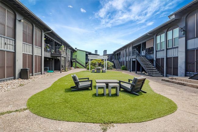 View of community with stairs and a yard | Image 15
