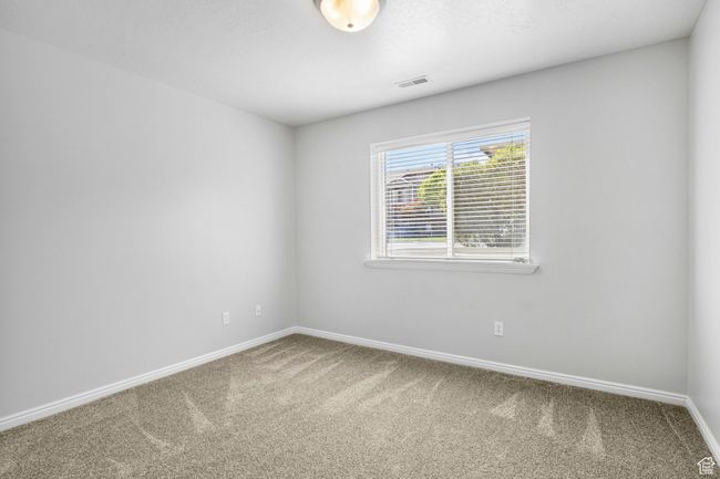 Carpeted spare room with baseboards | Image 9