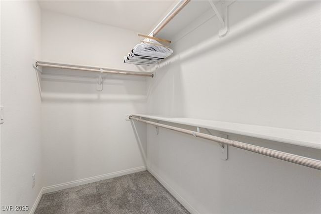 Walk in closet with light colored carpet | Image 18