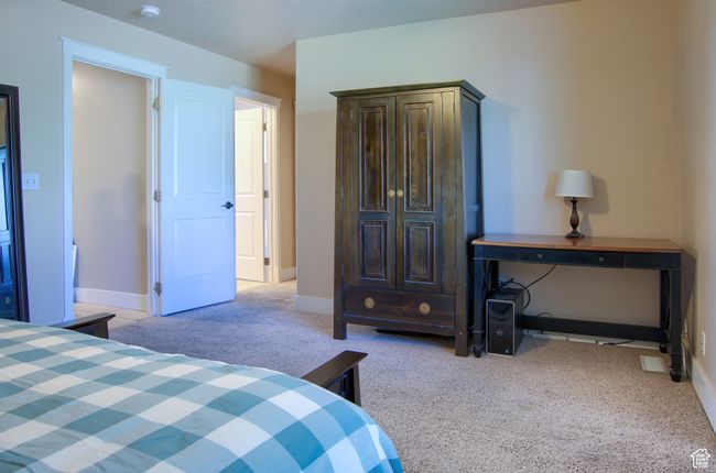 Bedroom featuring carpet floors and baseboards | Image 13