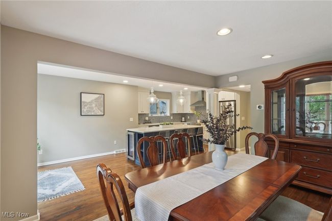 Dining space featuring baseboards, recessed lighting, ornate columns, and light wood-style flooring | Image 16