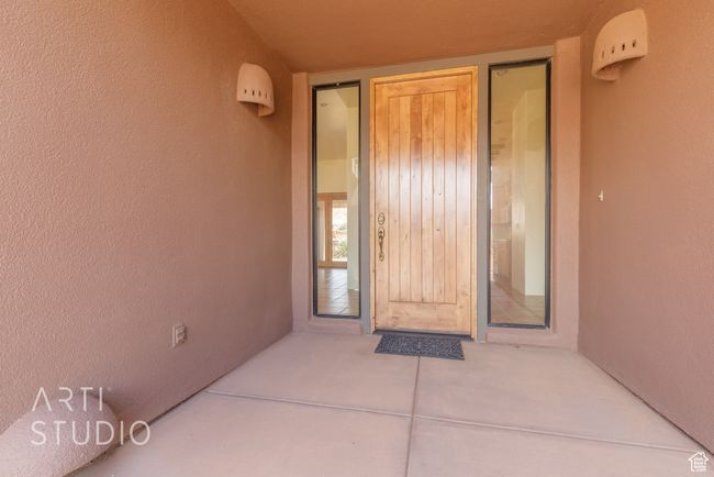 View of exterior entry featuring stucco siding | Image 9