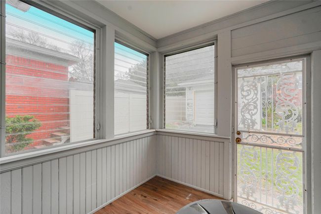 Unfurnished sunroom featuring wood finished floors | Image 17