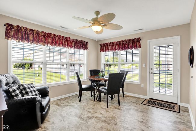 dining space featuring baseboards, plenty of natural light, and ceiling fan | Image 17