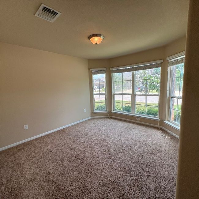 Front room second view with carpet flooring and baseboards | Image 12
