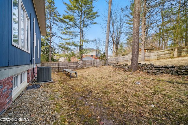 Tucked away on a private cul-de-sac in the coveted Pines Lake community, this sprawling 3, 640 sq. ft. contemporary home on 2.37 acres offers a unique blend of modern design, natural beauty, and timeless charm. | Image 50