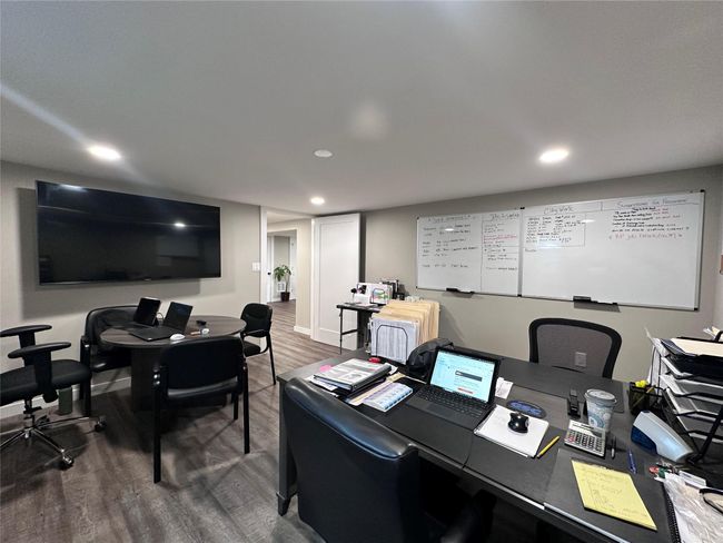 Home office featuring wood finished floors and recessed lighting | Image 18