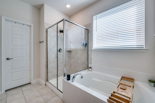 Full bathroom with tile patterned flooring, a shower stall, and a bath | Image 10
