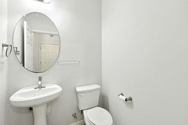 Featuring a guest powder room on the main level. | Image 9