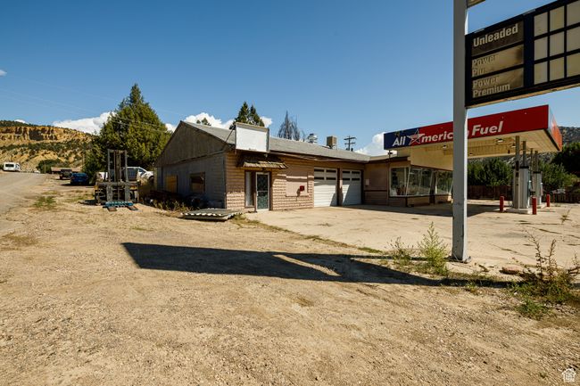 Rear view of property featuring a garage | Image 11