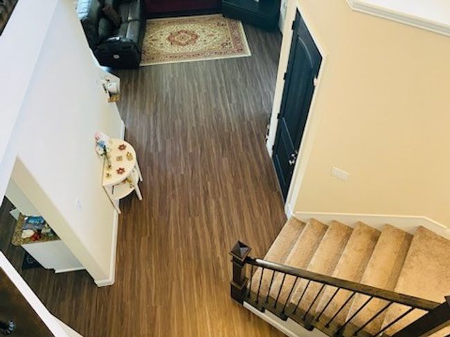 Stairs featuring wood finished floors | Image 9