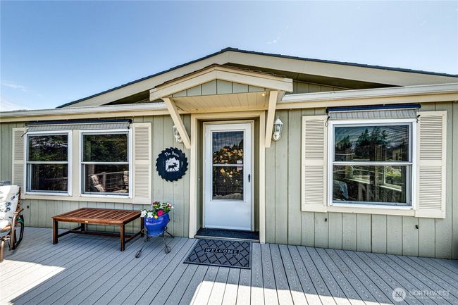 Welcoming entry. Shades and shutters for the windows. | Image 7
