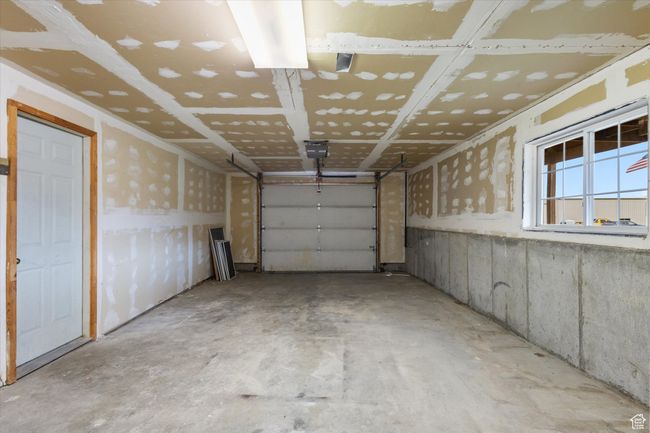 Garage with a garage door opener | Image 34