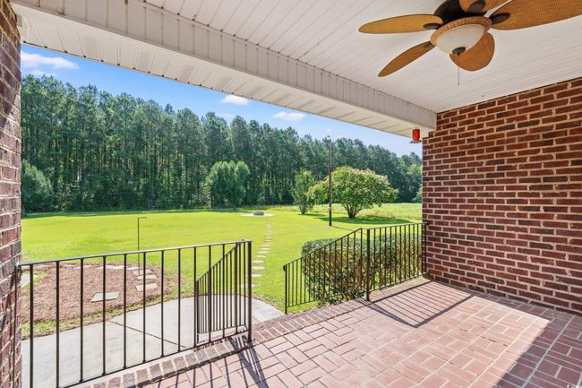 View of patio / terrace featuring a ceiling fan | Image 19