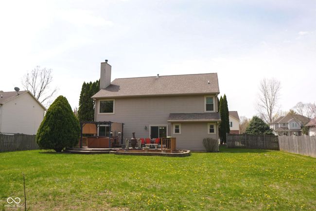 back of house with a wooden deck, a hot tub, and a pergola | Image 31