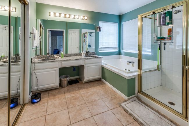 Deluxe bath with whirlpool tub, large separate shower, large closet space, vainity. double sinks. | Image 24