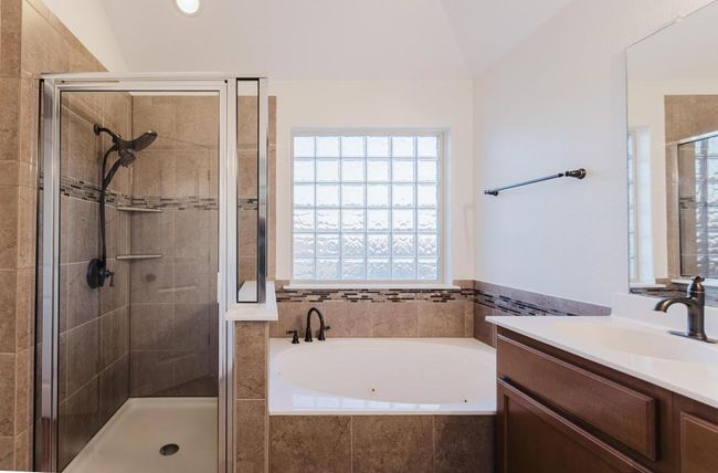 Full bath with a shower stall, vanity, and a garden tub | Image 32