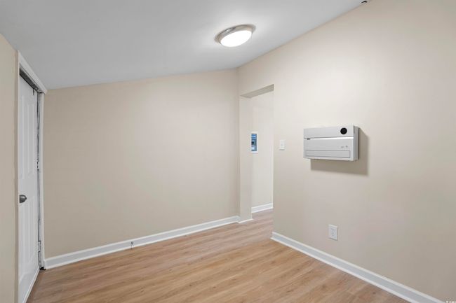 Empty room with light wood-style floors and baseboards | Image 39