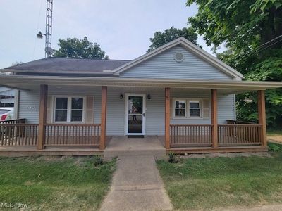 Bungalow-style house featuring a front yard and a porch | Image 3