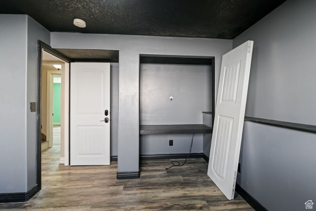Entrance foyer featuring baseboards and wood finished floors | Image 25