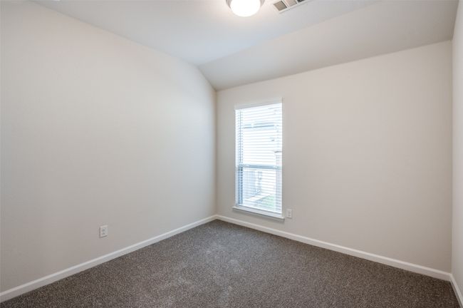 Carpeted spare room with vaulted ceiling | Image 22