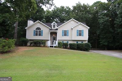 Vinyl Siding with stone accents on .63 acre with private wooded backyard | Image 1