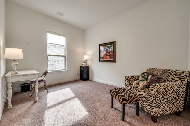 Bedroom #3 is set up as a sitting room. | Image 16