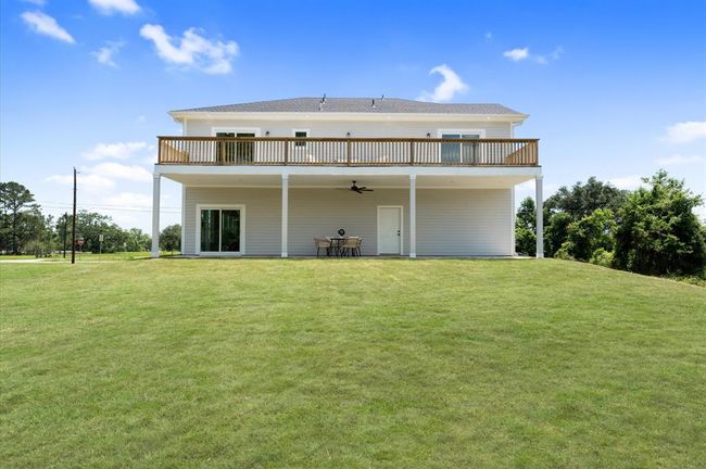 View of home from rear showing scale and layout. | Image 30