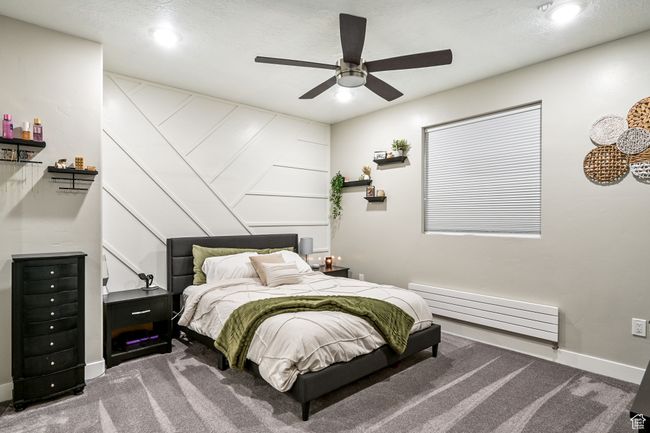Carpeted bedroom with a baseboard radiator, recessed lighting, and ceiling fan | Image 71